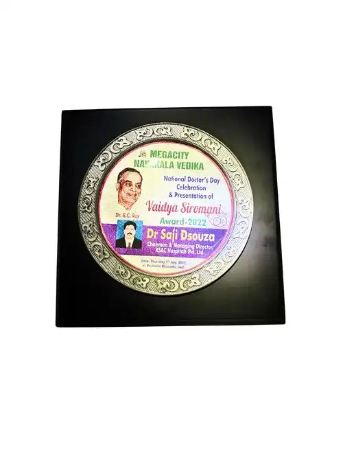 Decorative plate with a person's face on a black background