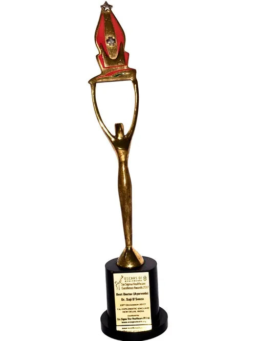 Decorative trophy with a gold figure and red top on a white background